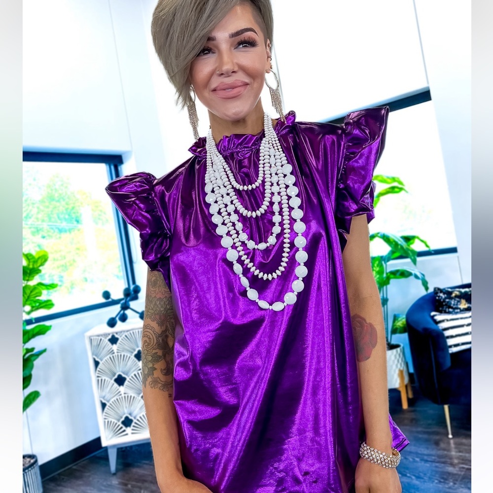 Purple metallic top with puffy sleeves. New without tags